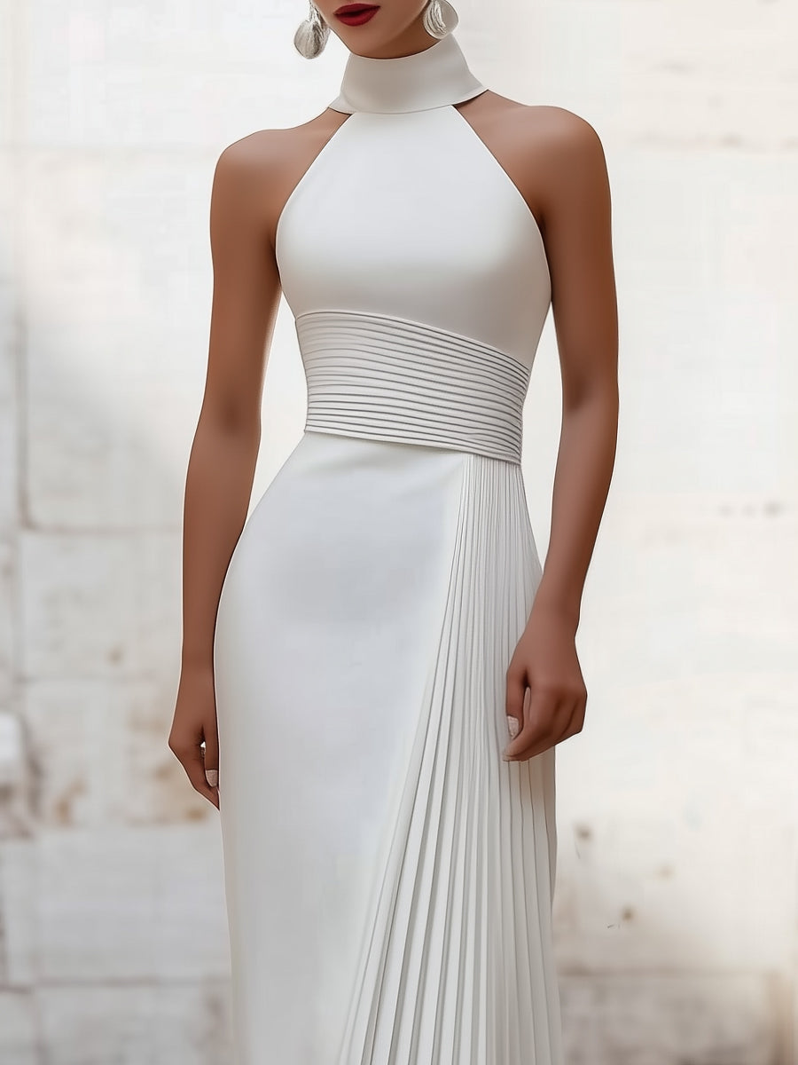 White Isabelle pleated halter-neck gown by Lumina Wear, elegant dress with flowing fabric and stylish design.