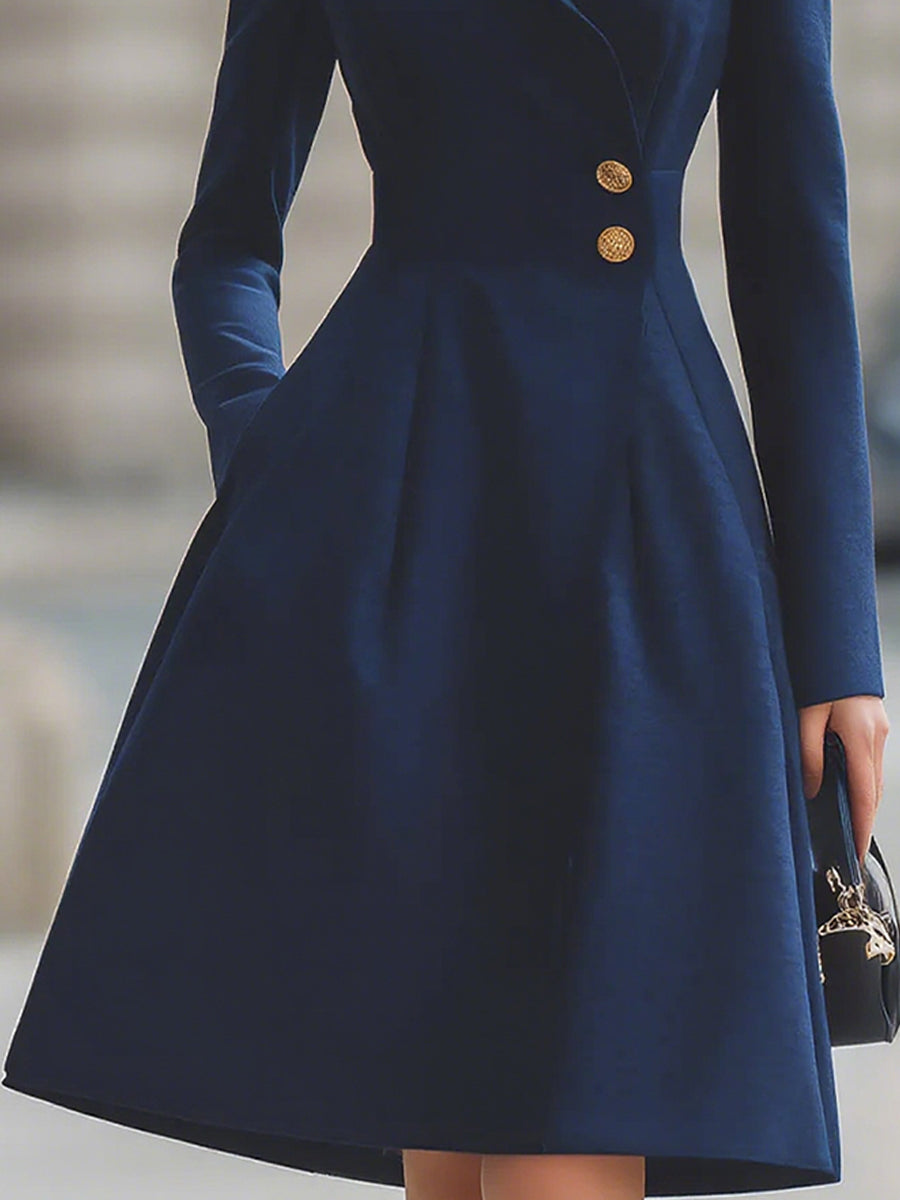 Navy blue Isabelle Lumina Vancouver tailored fit flared midi coat dress with peak lapel, shown on a model.