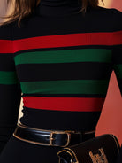Black Vivid Stripes Turtleneck Top by Lumina Wear, featuring colorful stripes and fitted design, displayed on a mannequin.