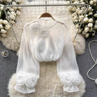 White blouse with 3D rose embroidery by Lumina Vancouver, featuring a stylish and elegant design, shown in size XS.