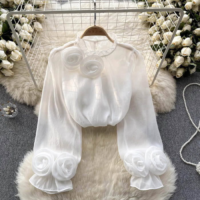 White blouse with 3D rose embroidery by Lumina Vancouver, featuring a stylish and elegant design, shown in size XS.