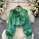 White blouse with 3D rose embroidery by Lumina Vancouver, featuring a stylish and feminine design, shown in size XS.