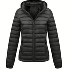 Black Isla Lumina Wear lightweight quilted hooded puffer jacket with fleece lining, shown on a model, size XS.