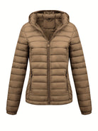 Black Isla lightweight quilted hooded puffer jacket with fleece lining by Lumina Wear, displayed on a hanger.