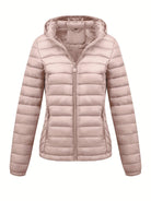 Black Isla Lumina Wear lightweight quilted hooded puffer jacket with fleece lining, shown on a hanger.