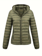Black Lumina Wear Isla lightweight quilted hooded puffer jacket with fleece lining, shown on a model.