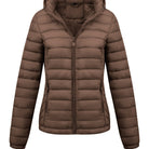 Black Isla Lumina Wear lightweight quilted hooded puffer jacket with fleece lining, shown on a model.