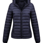 Black Isla Lumina Wear lightweight quilted hooded puffer jacket with fleece lining, shown on a model.