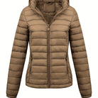 Black Lumina Wear Isla lightweight quilted hooded puffer jacket with fleece lining, shown on a model in size XS.