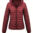 Black Isla lightweight quilted hooded puffer jacket with fleece lining by Lumina Wear, showing front view with hood and quilting details.