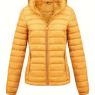 Black Isla lightweight quilted hooded puffer jacket with fleece lining by Lumina Wear, shown on a model.