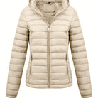 Black Isla lightweight quilted hooded puffer jacket with fleece lining from Lumina Wear, shown on a model, size XS.