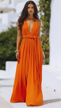 Orange Isla V-neck halter pleat maxi dress by Lumina Wear, flowing fabric, sleeveless design, perfect for summer or special occasions.