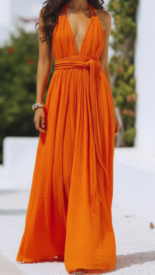 Orange Isla V-neck halter pleat maxi dress by Lumina Vancouver, featuring a flowing silhouette and elegant design.