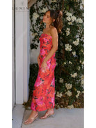 Red Jacyntha strapless summer chic dress by Lumina Vancouver, perfect for wedding guests, shown on a model.
