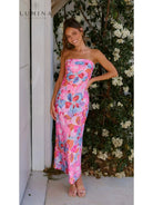 Red Jacyntha strapless summer chic dress by Lumina Vancouver, perfect for wedding guests, displayed on a model.