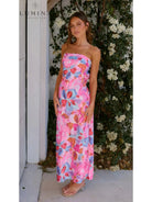 Red Jacyntha strapless summer chic dress by Lumina Vancouver, perfect for wedding guests, displayed on a model.