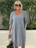Blue loose dress with pockets by Lumina Wear, featuring a relaxed fit and casual style, shown on a model.