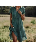 Elegant multi-color dress by Lumina Wear featuring bright blue fabric and stylish design, worn by model in a fashion photoshoot.