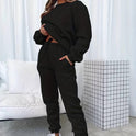 Black Jenna relaxed minimalist sweat set with jogger pants from Lumina Wear, casual and comfortable loungewear outfit.