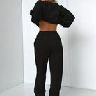 Black Jenna minimalist sweat set with jogger pants from Lumina Wear, featuring a relaxed fit and comfortable fabric.