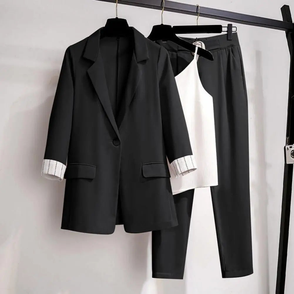 Black women's 2-piece set with tailored blazer, sleek pants, and versatile top from Lumina Wear, styled for a chic look.