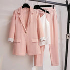 Black women's 2-piece set by Lumina Wear, featuring a tailored blazer, sleek pants, and versatile top, stylish and modern.
