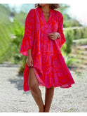 Red Joyce boho chic dress by Lumina Wear, featuring flowing fabric and elegant design, perfect for casual or special occasions.