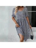 Blue floral printed casual dress by Lumina Wear, featuring a relaxed fit and elegant floral pattern on lightweight fabric.