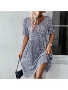 Blue Juliet casual floral printed dress by Lumina Vancouver displayed on a model, showcasing lightweight fabric and elegant design.