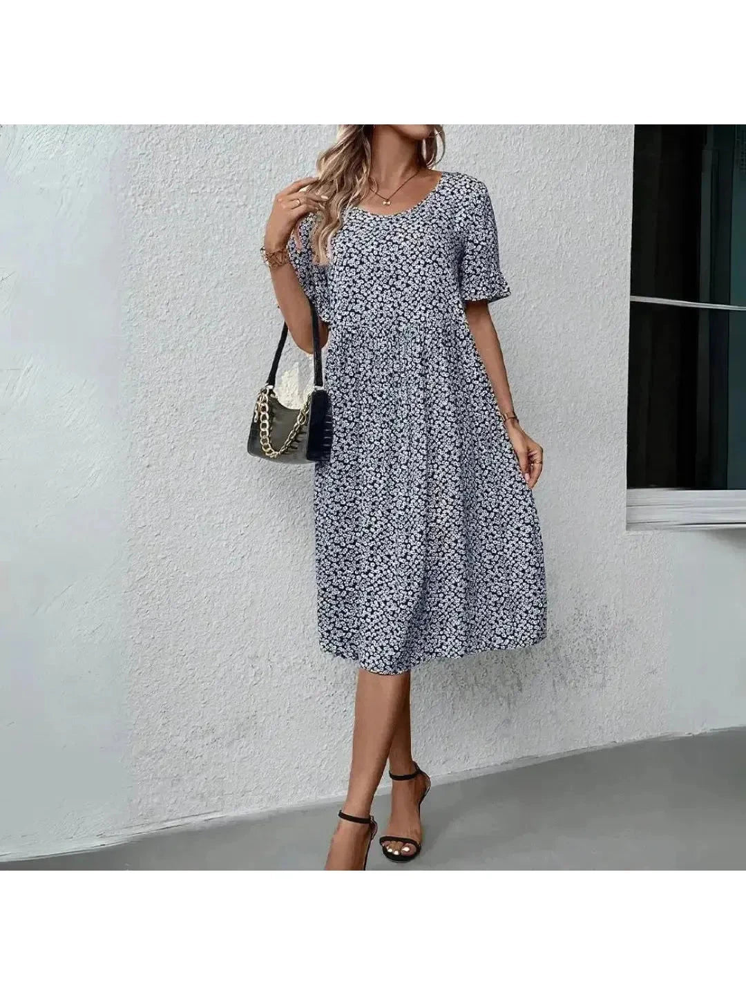 Blue floral printed dress by Lumina Wear, casual style with lightweight fabric, featuring a relaxed fit and floral pattern.