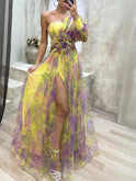 Purple one-shoulder floral maxi dress by Lumina Wear, flowing fabric, elegant design, ideal for summer or special occasions.