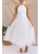 Kaylee Fairy Dress in creme for wedding guests by Lumina Vancouver, featuring a whimsical, flowy design perfect for special occasions.