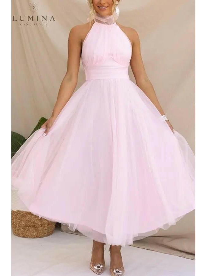 Cream-colored Kaylee fairy dress by Lumina Vancouver, perfect for wedding guests, with delicate details and flowing fabric.