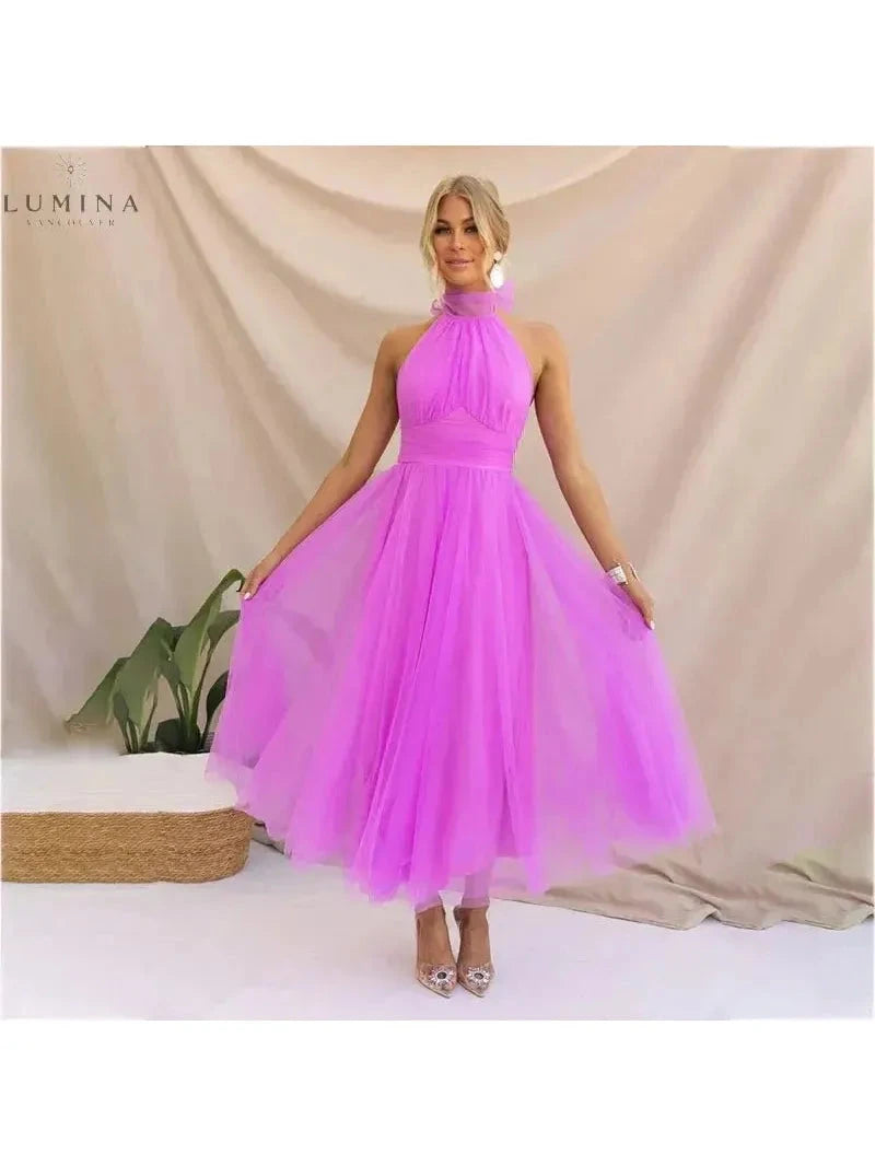 Cream-colored Kaylee fairy dress by Lumina Vancouver, perfect for wedding guests, with delicate details and flowing fabric.