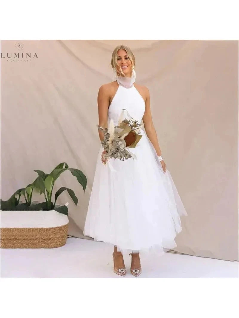 Cream-colored Kaylee fairy dress by Lumina Vancouver for wedding guests, featuring a whimsical, flowy design suitable for special occasions.