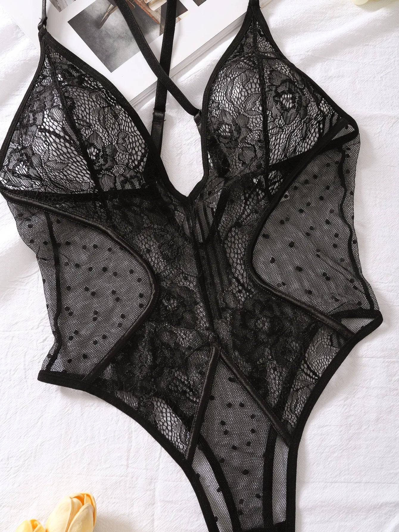 Lumina Vancouver Keira's bodysuit, fitted, black, with long sleeves and scoop neckline, displayed on a mannequin.