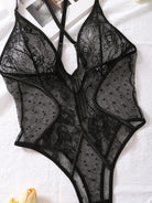 Lumina Vancouver Keira's bodysuit, fitted, black, with long sleeves and scoop neckline, displayed on a mannequin.