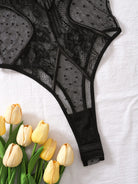 Lumina Vancouver Keira's Bodysuit, close-up of black fitted bodysuit with sleek design and seamless fit.