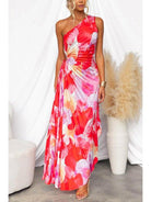 Red Kelsey pleated summer dress by Lumina Vancouver, perfect for wedding guests, shown on a model with flowing fabric.