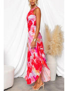 Red Kelsey pleated summer dress by Lumina Vancouver, perfect for wedding guests, shown on a model.