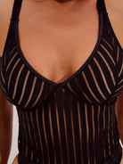 Black Kiki Bodysuit by Lumina Vancouver, form-fitting with long sleeves, displayed on a mannequin.