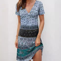 Green Kira mini dress by Lumina Wear featuring relaxed fit and patchwork boho style, shown on a model.