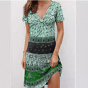 Green Kira mini dress by Lumina Wear featuring relaxed fit and patchwork boho style, shown on a model.