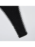 Kristina's Bodysuit by Lumina Vancouver, close-up of sleek black bodysuit with fitted design and scoop neckline.
