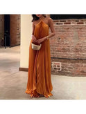 Orange Lumina Wear Kyla chic pleated halter neck maxi dress, showing the flowing fabric and elegant design.