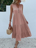 Wine red Laiza™ elegant summer dress by Lumina Vancouver, displayed on a hanger with floral background.