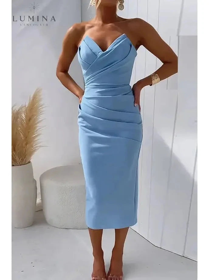 Blue Laura strapless wedding guest dress by Lumina Vancouver, elegant sleeveless design with fitted bodice and flowing skirt.