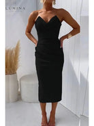 Blue strapless wedding guest dress named Laura by Lumina Vancouver, shown on a model with elegant fit and flowing fabric.