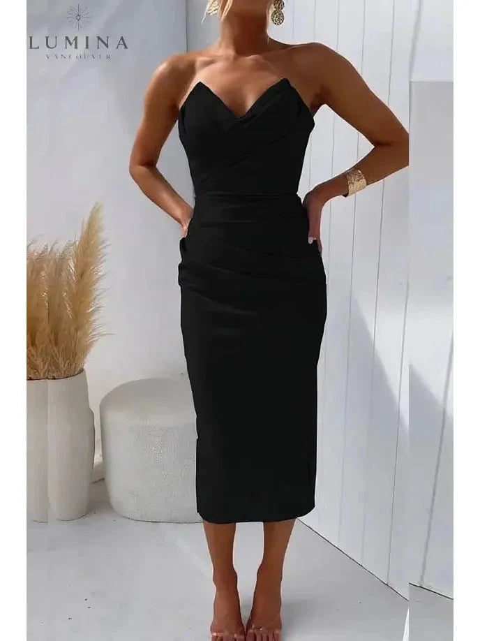 Blue strapless wedding guest dress named Laura by Lumina Vancouver, shown on a model with elegant fit and flowing fabric.